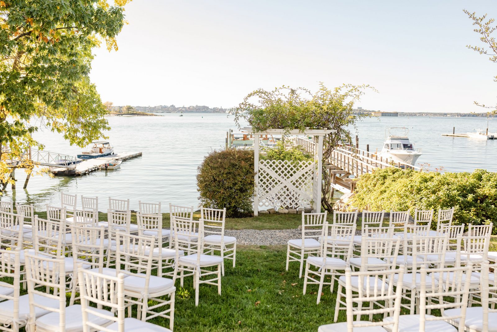 Outdoor Lawn Ceremony White Wedding Chairs Ocean Front Wedding Jones Landing Peaks Island Portland Maine